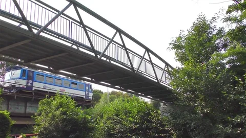 Old Bridge on the River and Small Train Stock Footage 73197060