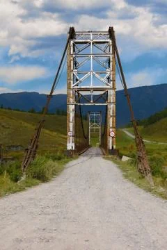 Old bridge through river Katun. Russia Siberia Stock Photos