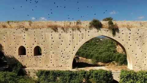 Old Bridge Under Ancient Canal Crows Fly Video stock 121444957