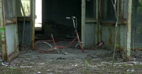 Old broken bicycle in front of ruined building Stock Footage 200949867