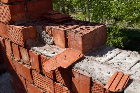 Old broken brick wall, damaged bricks close-up Stock Photos