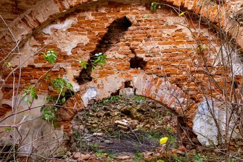 An old broken brick wall in an old castle. broken vaults Stock Photos