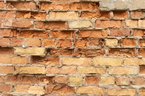 Old, broken brick wall texture. Abandoned, ruined building in Latvia, Europe. Stock Photos