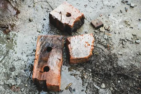 Old broken bricks at the construction site - top view. Industrial background Stock Photos