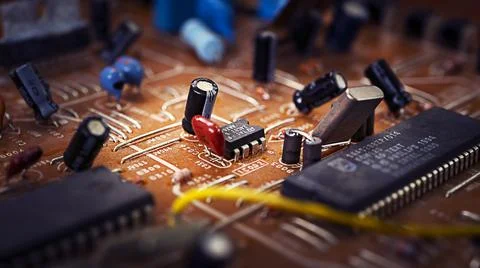 Old broken brown microcircuit close-up, old technology Stock Photos