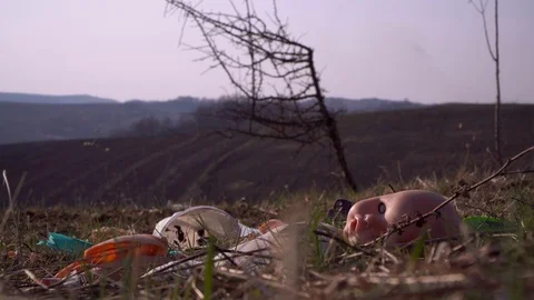 Old broken doll lying on the garbage Stock Footage 126663413