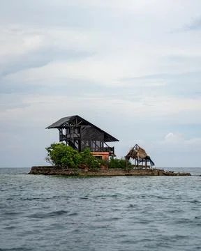 Old broken down hut structure on an island Photos