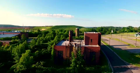 Old broken down prison buildings and power plant with Gun tower Stock Footage 195947689