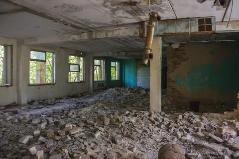 Old broken empty abandoned industrial building interior. abandoned factory Stock Photos