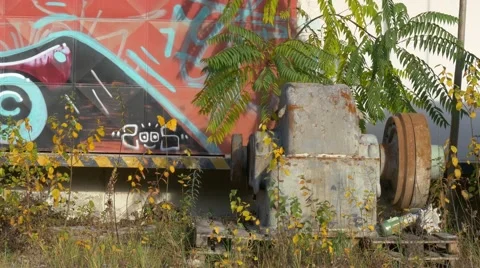 Old broken engine in front of graffiti wall Stock Footage 57115802
