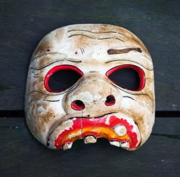 Old broken ethnic mask Stock Photos