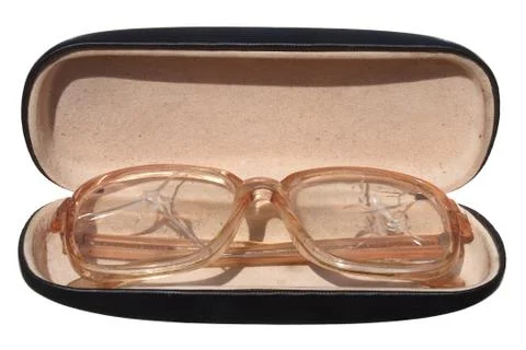 Old broken glasses in a case isolated on white background. Stock Photos