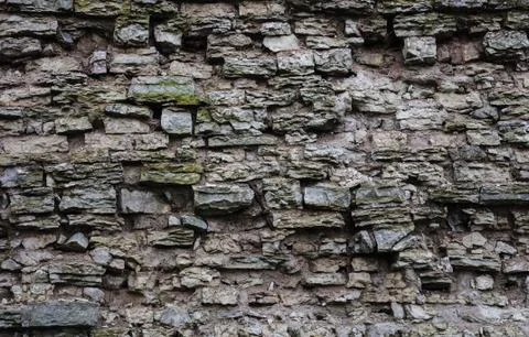 Old broken gray stone wall background Stock Photos