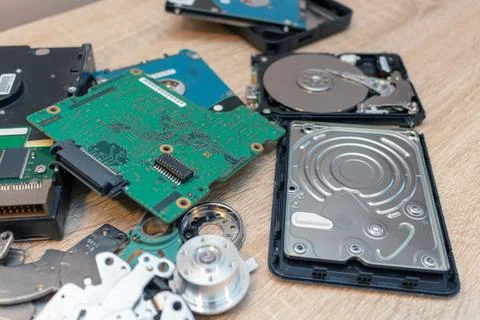 Old broken hard disk drives composition in a repair recovery service concept  Stock Photos
