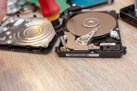 Old broken hard disk drives composition in a repair recovery service concept  Stock Photos