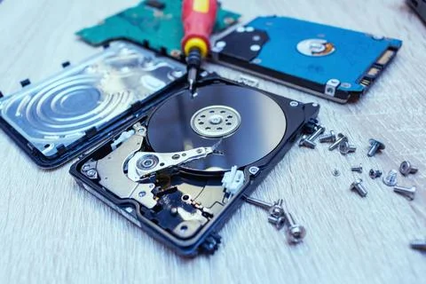 Old broken hard disk drives composition in a repair recovery service concept  Stock Photos