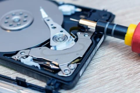 Old broken hard disk drives composition in a repair recovery service concept  Stock Photos