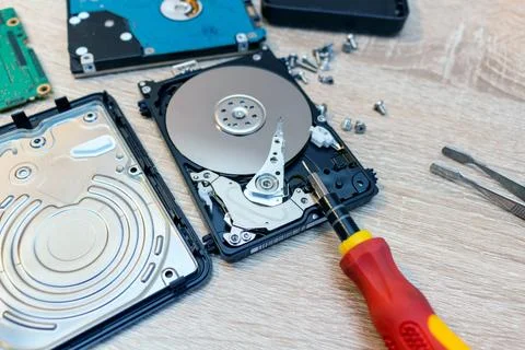 Old broken hard disk drives composition in a repair recovery service concept  Stock Photos