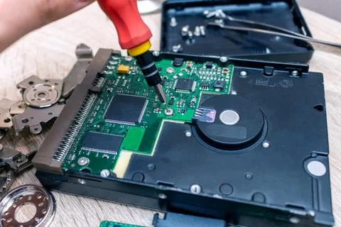 Old broken hard disk drives composition in a repair recovery service concept  Stock Photos