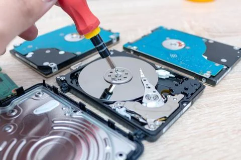 Old broken hard disk drives composition in a repair recovery service concept  Stock Photos