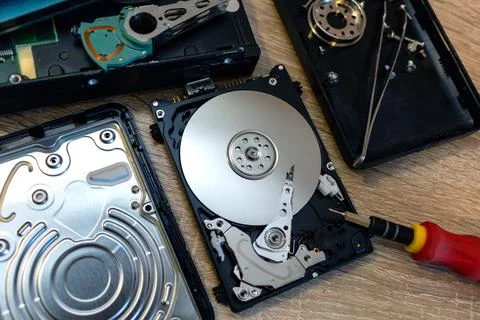Old broken hard disk drives composition in a repair recovery service concept  Stock Photos