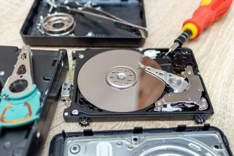 Old broken hard disk drives composition in a repair recovery service concept  Stock Photos