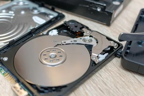 Old broken hard disk drives composition in a repair recovery service concept  Stock Photos
