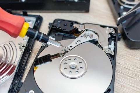 Old broken hard disk drives composition in a repair recovery service concept  Stock Photos