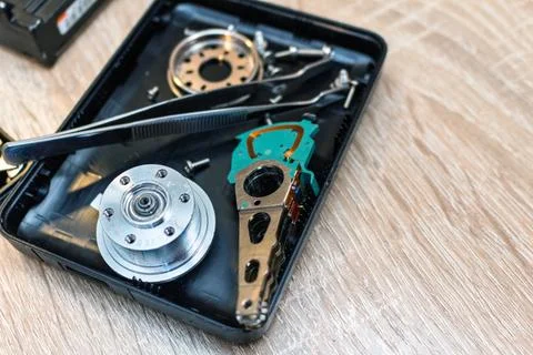 Old broken hard disk drives composition in a repair recovery service concept  Stock Photos