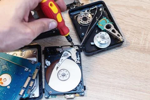 Old broken hard disk drives composition in a repair recovery service concept  Stock Photos