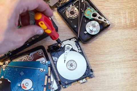 Old broken hard disk drives composition in a repair recovery service concept  Stock Photos