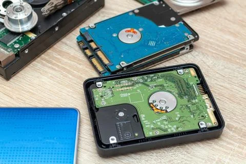 Old broken hard disk drives composition in a repair recovery service concept  Stock Photos