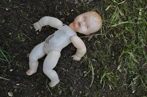 Old broken plastic doll Stock Photos