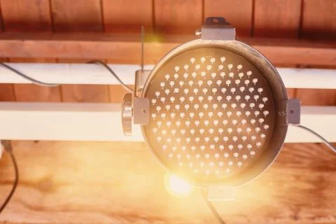 Old broken spotlights on a tree background Stock Photos