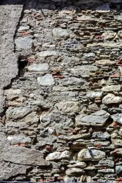An old broken wall on the facade of an old house 스톡 사진