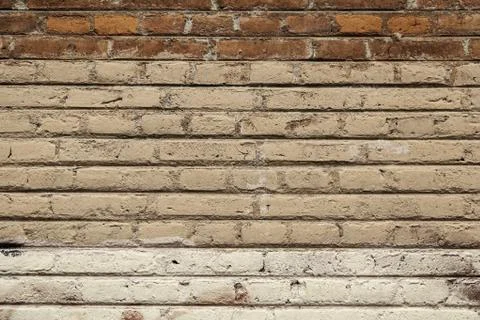 Old broken wall made of mud bricks, textured background detail, neglect and r Stock Photos