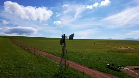 Old broken wind pump on a field in South Africa Stock Footage 343897913