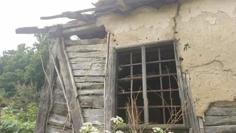 Old broken window on an old and abandoned house Stock Photos