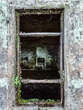 Old broken window on a weathered stone wall Stock Photos