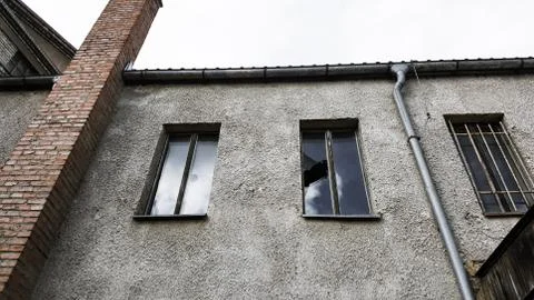 Old broken windows on an abandoned old building. Vintage tone Stock Photos