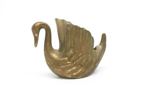 Old bronze candlestick in shape Swan isolated on a white background Stock Photos