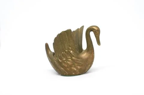 Old bronze candlestick in shape Swan isolated on a white background Stock Photos