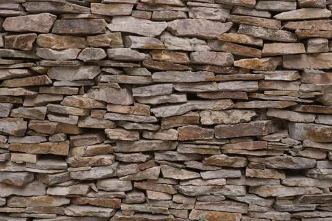 Old brown brick wall pattern. Stone background. Stock Photos