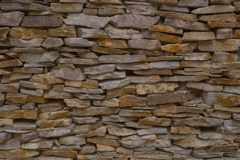 Old brown brick wall pattern. Stone background. Stock Photos
