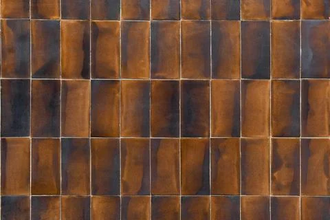 Old brown ceramic tiles with a gradient. Stock Photos