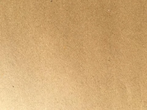 Old brown paper texture background or cardboard with copy space for design. Stock Photos