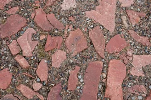 Old brown paving top view or granite cobblestone road. Ancient brick cobblest Stock Photos