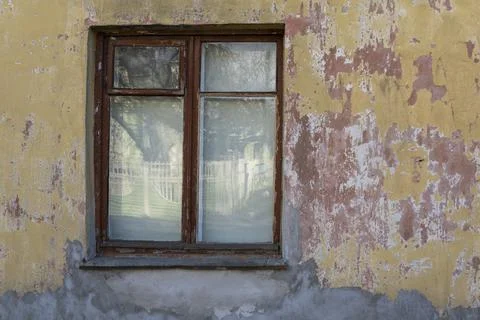 Old brown window on the old wall Stock Photos