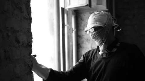 Old builder working on In glasses Stock Photos