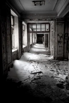 Old building after fire in winter time with snow inside and broken windows Stock Photos